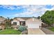 Charming single-story home featuring a well-manicured front yard, stone accents, and an attached two-car garage at 21062 Hawthorne Ln, Parker, CO 80138
