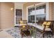 Cozy front porch setting with comfortable seating, perfect for enjoying the outdoors at 21062 Hawthorne Ln, Parker, CO 80138