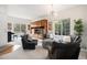 Bright living room with comfortable seating, stylish decor, and large windows offering plenty of natural light at 21062 Hawthorne Ln, Parker, CO 80138