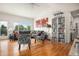 Inviting living room with vaulted ceilings, hardwood floors, and stylish decor for a comfortable living space at 21062 Hawthorne Ln, Parker, CO 80138