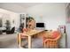 Comfortable home office with large desk and shelves, natural light, and room to work or read at 21062 Hawthorne Ln, Parker, CO 80138