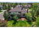 Aerial view of a home highlighting its mature landscaping, backyard patio, and proximity to surrounding trees at 5694 S Pagosa Ct, Centennial, CO 80015