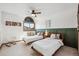 Bright bedroom featuring two twin beds, a window with natural light, and a decorative ceiling fan at 5694 S Pagosa Ct, Centennial, CO 80015