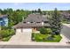 Charming two-story home featuring a three-car garage and beautifully landscaped front yard at 5694 S Pagosa Ct, Centennial, CO 80015