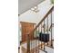 Inviting foyer with hardwood floors, staircase, and modern lighting fixtures at 5694 S Pagosa Ct, Centennial, CO 80015