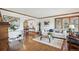 Bright living room with hardwood floors, large windows, and elegant decor at 5694 S Pagosa Ct, Centennial, CO 80015
