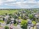 Picturesque neighborhood with a mix of homes and green spaces, complemented by a clear sky and distant views at 9810 Venneford Ranch Rd, Highlands Ranch, CO 80126