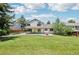 Sprawling backyard with lush lawn and large trees, perfect for outdoor activities and relaxation at 9810 Venneford Ranch Rd, Highlands Ranch, CO 80126