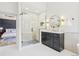 Bright bathroom featuring a sleek glass shower, vanity, and modern fixtures at 9810 Venneford Ranch Rd, Highlands Ranch, CO 80126
