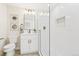 Bright bathroom featuring a glass-enclosed shower with mosaic tile and a white vanity at 9810 Venneford Ranch Rd, Highlands Ranch, CO 80126