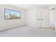 Bright, open bedroom with a large window and closet at 9810 Venneford Ranch Rd, Highlands Ranch, CO 80126