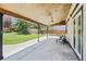 Covered patio features a ceiling fan and overlooks a large backyard at 9810 Venneford Ranch Rd, Highlands Ranch, CO 80126