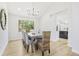 Well-lit dining room featuring hardwood floors and a chandelier with lots of natural light at 9810 Venneford Ranch Rd, Highlands Ranch, CO 80126