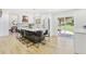 Bright kitchen with white cabinets, an island with seating, and stainless steel appliances at 9810 Venneford Ranch Rd, Highlands Ranch, CO 80126