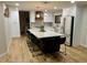 Spacious kitchen with a large island, modern appliances, and ample cabinet space, perfect for cooking and entertaining at 9810 Venneford Ranch Rd, Highlands Ranch, CO 80126