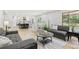 Open living room features hardwood floors with views of an eat-in kitchen at 9810 Venneford Ranch Rd, Highlands Ranch, CO 80126