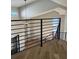 Open loft area featuring contemporary black metal railings and modern light fixture, offering a stylish and airy feel at 9810 Venneford Ranch Rd, Highlands Ranch, CO 80126