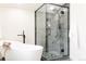 Luxurious bathroom showcasing a glass-enclosed shower and a modern soaking tub at 1390 S Jasmine Way, Denver, CO 80224