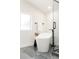 Modern bathroom featuring a freestanding tub, sleek fixtures, and a bright window at 1390 S Jasmine Way, Denver, CO 80224
