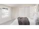 Bedroom with closet doors, a window, and modern decor, offering a tranquil and stylish retreat at 1390 S Jasmine Way, Denver, CO 80224