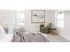 Bedroom featuring a cozy chair, natural light, and stylish decor, creating a relaxing atmosphere at 1390 S Jasmine Way, Denver, CO 80224