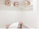 Well-organized closet with shelving and a bench, providing ample storage space at 1390 S Jasmine Way, Denver, CO 80224