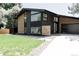 Contemporary home exterior boasting clean lines, modern architecture, and a well-maintained lawn at 1390 S Jasmine Way, Denver, CO 80224