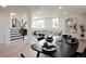 Spacious living area with a staircase, open layout, and stylish furnishings at 1390 S Jasmine Way, Denver, CO 80224