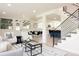 Open-concept living area with dining space, kitchen, and contemporary decor at 1390 S Jasmine Way, Denver, CO 80224
