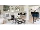 Cozy living space with modern furnishings, dining area, and access to the outdoors at 1390 S Jasmine Way, Denver, CO 80224