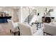 Spacious living area with a staircase, modern furniture, and an open layout at 1390 S Jasmine Way, Denver, CO 80224