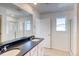 Modern bathroom with double vanity sinks, quartz countertop, and glass-enclosed shower at 21242 E 63Rd Dr, Aurora, CO 80019