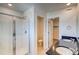 Bright bathroom with double sink vanity, walk-in shower, and toilet room for added privacy at 21242 E 63Rd Dr, Aurora, CO 80019