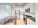 Stylish kitchen with stainless steel appliances and granite countertops, open layout at 21242 E 63Rd Dr, Aurora, CO 80019