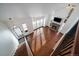 High-angle view of a bright living room with hardwood floors and fireplace at 6593 Owens Ct, Arvada, CO 80004