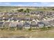 An aerial view showcases the home's location within a beautifully planned community and green spaces at 2351 Monte Vista St, Fort Lupton, CO 80621