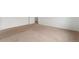 Bedroom featuring plush carpeting, neutral walls, base trim, and an open doorway to another room at 2351 Monte Vista St, Fort Lupton, CO 80621