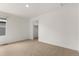 Bedroom featuring plush carpeting, neutral walls, base trim, and an open doorway to a walk-in closet at 2351 Monte Vista St, Fort Lupton, CO 80621