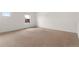 Neutral bedroom with carpeted floors and a window adding natural light, creating a cozy atmosphere at 2351 Monte Vista St, Fort Lupton, CO 80621
