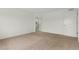 Bedroom featuring plush carpet, a window, a walk-in closet, and an attached bathroom with white tile at 2351 Monte Vista St, Fort Lupton, CO 80621