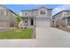 Charming two-story home featuring a well-manicured lawn, attached garage, and traditional architecture at 2351 Monte Vista St, Fort Lupton, CO 80621