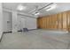 Open garage featuring concrete floors, exposed wood framing, and overhead lighting ready for vehicles at 2351 Monte Vista St, Fort Lupton, CO 80621