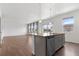 Kitchen island with granite countertops seamlessly connects to the open living space at 2351 Monte Vista St, Fort Lupton, CO 80621