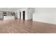 Spacious open-concept living and dining room with beautiful hardwood flooring at 2351 Monte Vista St, Fort Lupton, CO 80621