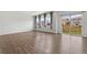Bright living space featuring large windows with backyard views and wood flooring at 2351 Monte Vista St, Fort Lupton, CO 80621