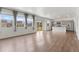 Open living area with plenty of natural light and wood flooring at 2351 Monte Vista St, Fort Lupton, CO 80621
