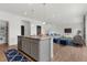 Open concept kitchen with a large island, great for entertaining, and easy access to the living room at 2351 Monte Vista St, Fort Lupton, CO 80621