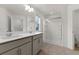 Spacious main bathroom with double vanity and glass-enclosed shower at 2351 Monte Vista St, Fort Lupton, CO 80621