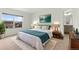 Comfortable main bedroom offers great natural light, ensuite bathroom, and neutral decor at 2351 Monte Vista St, Fort Lupton, CO 80621