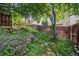 Landscaped backyard with stone steps and colorful flowers at 6506 S Robb Way, Littleton, CO 80127